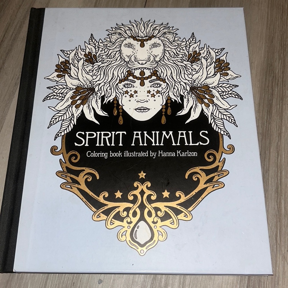 Spirit animals coloring book. Comes with metallic Colored pencils. (Unopened)